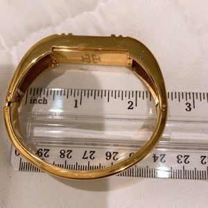 Tory Burch fitbit wristlet , gold .
